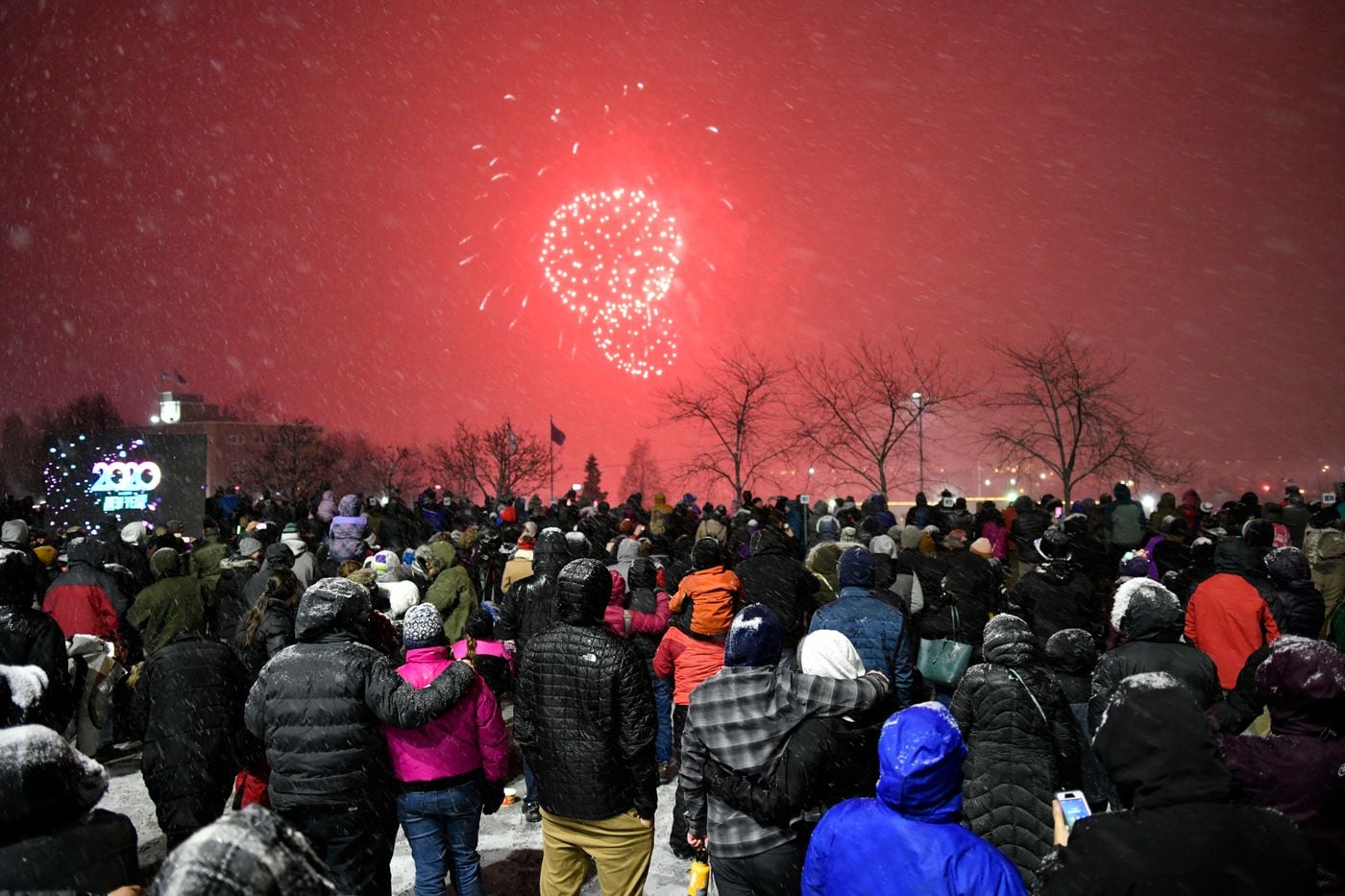 Snow falls and fireworks fly as Anchorage celebrates the start of a new