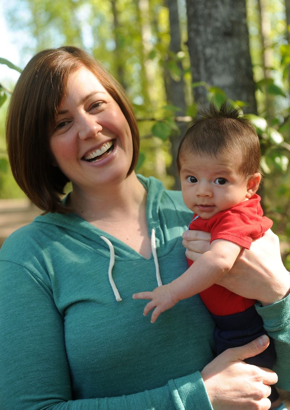 The Alaska Child Care Market Is Broken For Parents And Caregivers - katie hubbard holds her 2 month old son jack near university lake