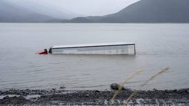 Driver rescued from cab after semi veers off Seward Highway into Turnagain Arm