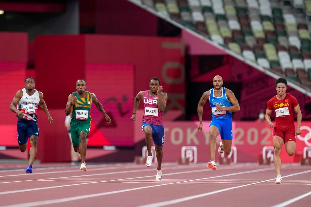 Chijindu Utah of Britain, Akani Simbine of South Africa, Ronnie Baker of the United States, Lamont Marcell Jacobs of Italy and Su Bingtian, of China, from left to right, compete in a men's 100-meter semifinal at the 2020 Summer Olympics, Sunday, Aug. 1, 2021, in Tokyo. (Petr David Josek / Associated Press)