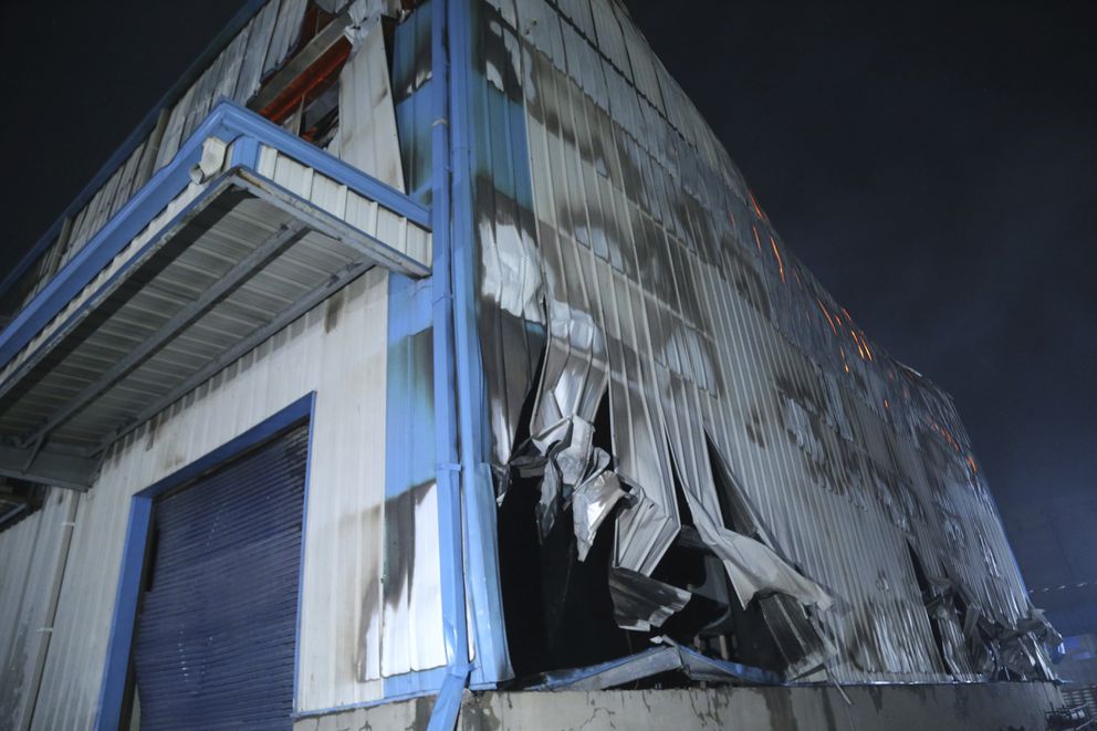 This Saturday, Feb. 8, 2020 photo, shows the damage after a fire broke out at Nandan Denim, one of the largest denim suppliers in the world, in Ahmedabad, India. At least seven people died in the blaze that swept the factory that has ties to major U.S. retailers, according to its website. Some of the U.S. and multinational companies listed on the website said they were not actually customers, and many issued statements that strongly condemned dangerous work sites. Rajesh Bhatt, a senior fire official at the scene, told The Associated Press that the factory had just one door that could only be reached by climbing a steep ladder. (AP Photo)