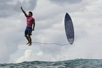 Right place, right time: The story behind the viral surfing photo from the Paris Olympics