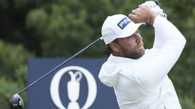 Daniel Brown makes late birdies for a 1-shot lead over Shane Lowry in wind-challenged British Open