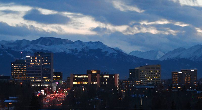 Commuter traffic travels south on C Street near Midtown in Anchorage after sunset on Wednesday afternoon, Jan. 13, 2021. (Bill Roth / ADN) 