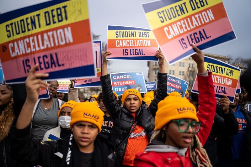 People rally to show support for the Biden administration’s student debt relief plan in front of the Supreme Court on Feb. 28 in Washington, D.C. (Kent Nishimura/Los Angeles Times/TNS)