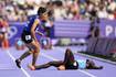 An Olympic sprinter fell injured. So her opponent turned back.