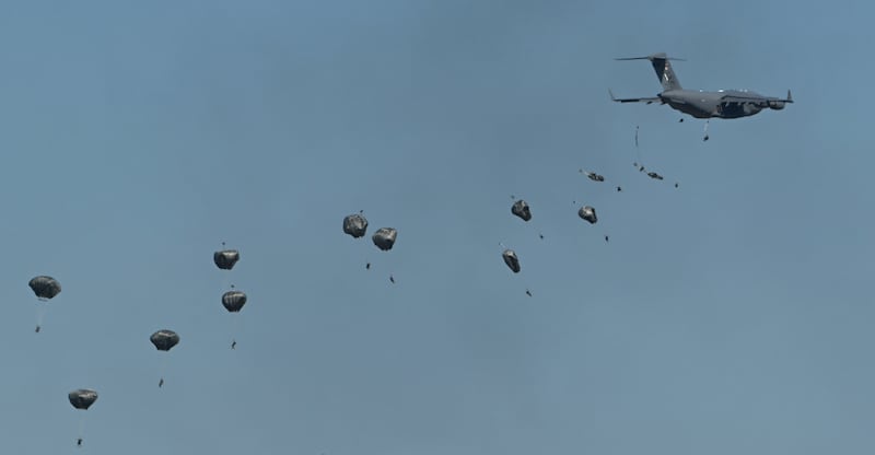 Paratroopers jump from a C-17 Globemaster III on the final day of the Arctic Thunder Open House at Joint Base Elmendorf-Richardson on Sunday, July 21, 2024. (Bill Roth / ADN)