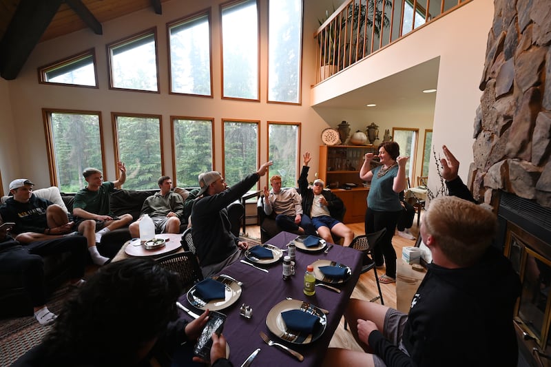 After a doubleheader was rained out, Anchorage Bucs host Jennifer Mattingly asked players who went hiking or to the gym, if so, they were first in line to eat dinner at her Hillside home on Sunday. (Bill Roth / ADN) 