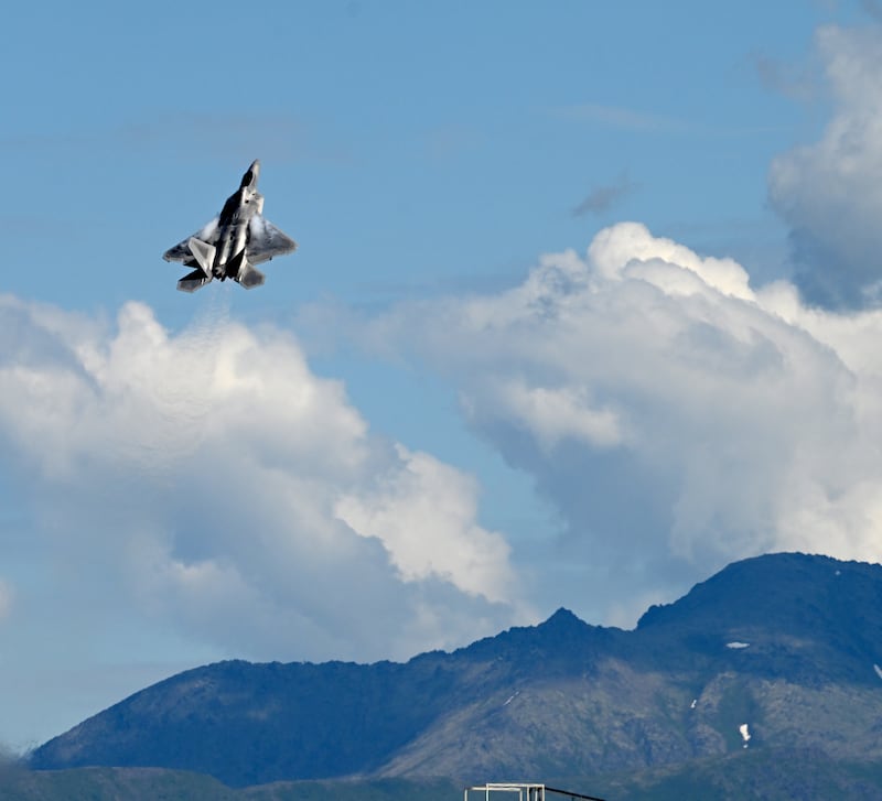 An F-22 starts a steep climb during the Arctic Thunder air show at JBER in Anchorage on Saturday. The F-22 demonstration team is out of Joint Base Langley-Eustis, Virginia. (Bob Hallinen Photo)
