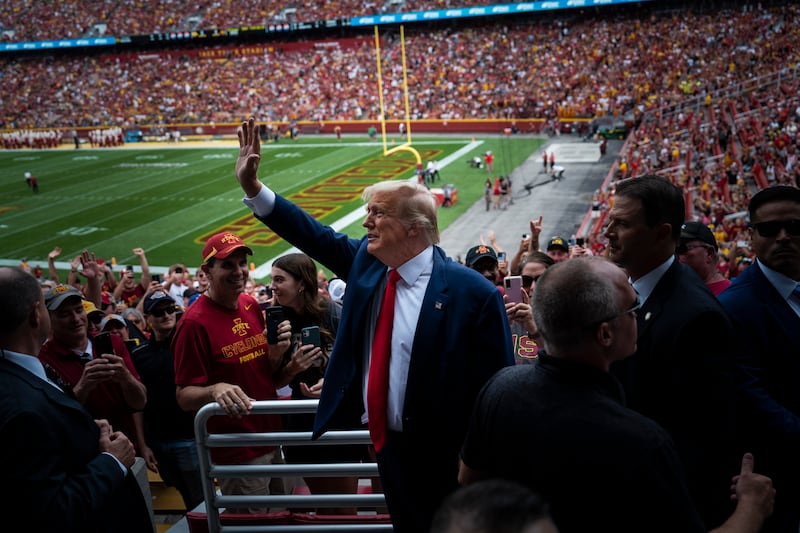 Trump waves to the crowd before the start of an NCAA college football game at Jack Trice Stadium on Sept. 9, in Ames, Iowa. (Jabin Botsford/The Washington Post)