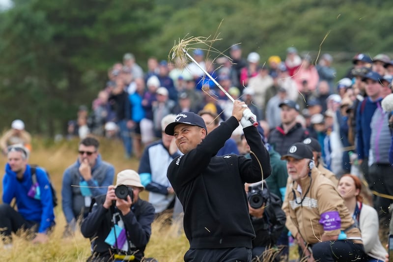 Xander Schauffele of the United States plays from the rough on the 12th hole during his final round of the British Open Golf Championships at Royal Troon golf club in Troon, Scotland, Sunday, July 21, 2024. (AP Photo/Jon Super)