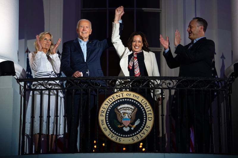 First lady Jill Biden, left, and second gentleman Douglass Emhoff, right, watch as President Joe Biden, center left, raises the hand of Vice President Kamala Harris as they view the Independence Day firework display over the National Mall from the balcony of the White House, July 4, 2024, in Washington. She's already broken barriers, and now Harris could soon become the first Black woman to head a major party's presidential ticket after President Joe Biden's ended his reelection bid. The 59-year-old Harris was endorsed by Biden on Sunday, July 21, after he stepped aside amid widespread concerns about the viability of his candidacy. (AP Photo/Evan Vucci, File)