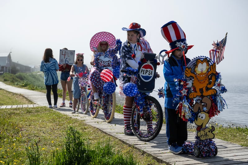 Kids of King Cove participate in the bike parade, part of the Independence Day celebration activities organized by the King Cove Women’s Club on July 3, 2024. (Marc Lester / ADN)
