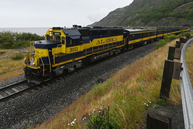 A southbound Alaska Railroad passenger train rolls past Beluga Point on Tuesday, July 16, 2024. (Bill Roth / ADN)