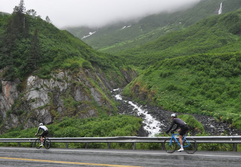 Competitors in the 200-mile Fireweed bicycle race to Valdez ride into Keystone Canyon on Saturday, July 13, 2024. (Vicky Ho / ADN)