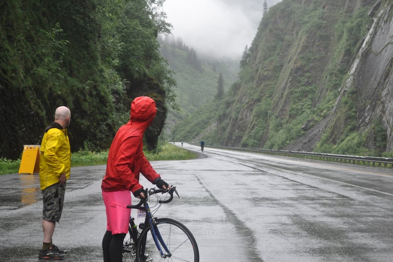 A rider on the "Don't Spoke the Bear" team in the Fireweed's open division waits for their teammate to make the relay exchange in Keystone Canyon during the 200-mile bicycle race to Valdez on Saturday, July 13, 2024. (Vicky Ho / ADN)