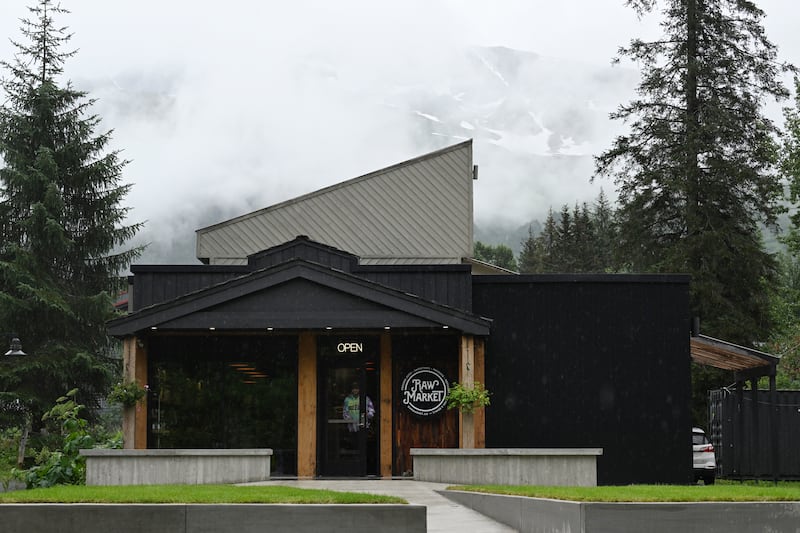 Rain clouds obscure the Chugach Mountains beyond the recently opened Raw Market, a refillery, juice bar and grocer in Girdwood.  (Bill Roth / ADN)