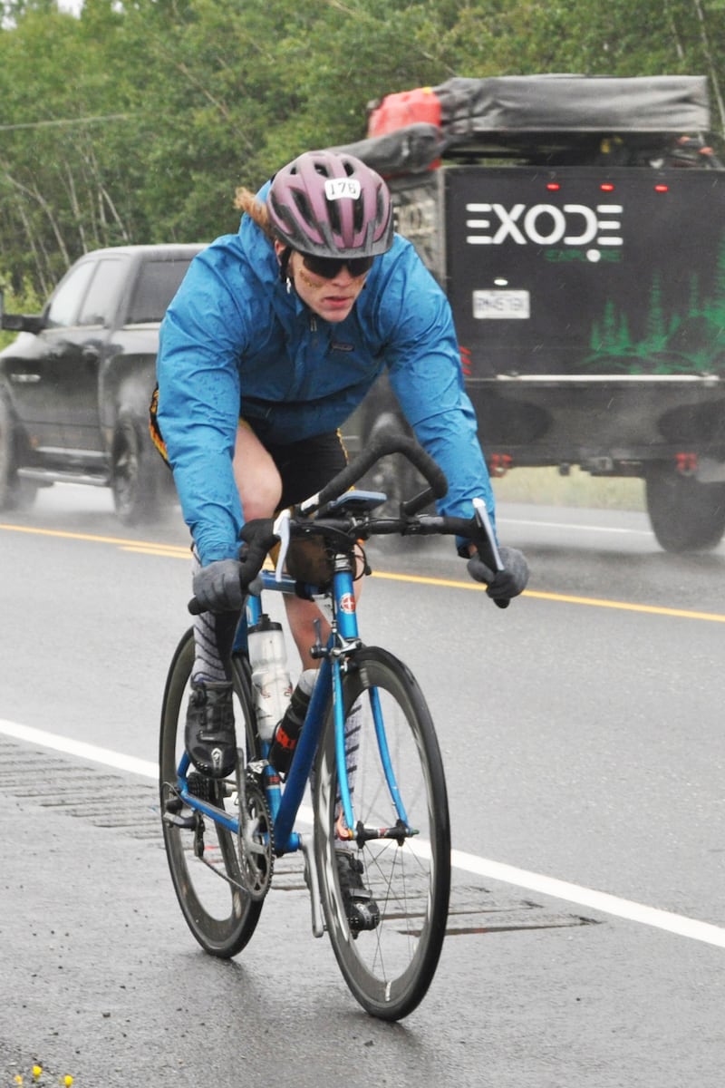 Ramy Yates, competing in the 200-mile Fireweed bicycle race's solo male division, rides in the rain along the Richardson Highway toward the Willow Creek aid station at Mile 91 on Saturday, July 13, 2024.  (Vicky Ho / ADN)