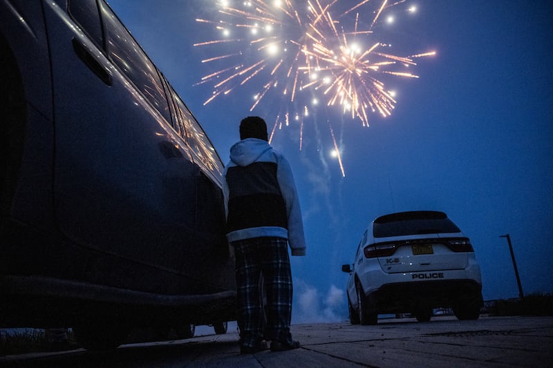 Carloads of people watch midnight fireworks to celebrate Independence Day in King Cove on July 4, 2024. (Marc Lester / ADN)