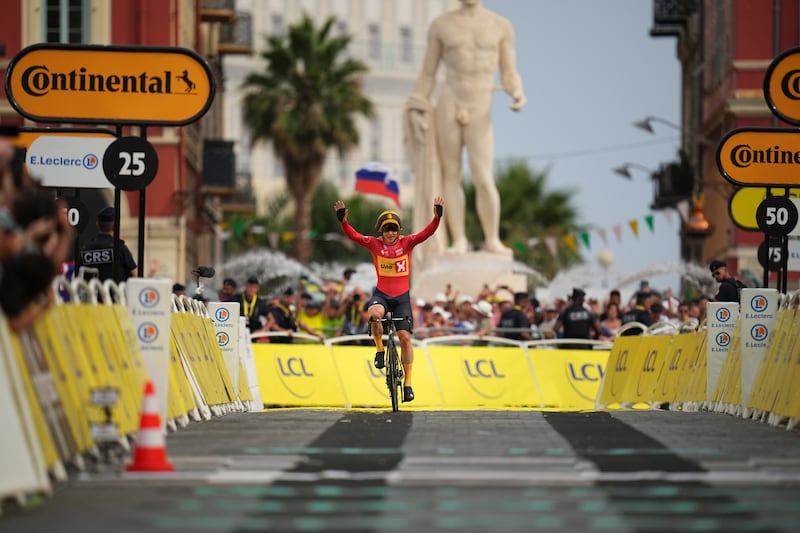 Norway's Jonas Abrahamsen celebrates when nearing the finish line of the twenty-first stage of the Tour de France cycling race, an individual time trial over 33.7 kilometers (20.9 miles) with start in Monaco and finish in Nice, France, Sunday, July 21, 2024. (AP Photo/Daniel Cole)