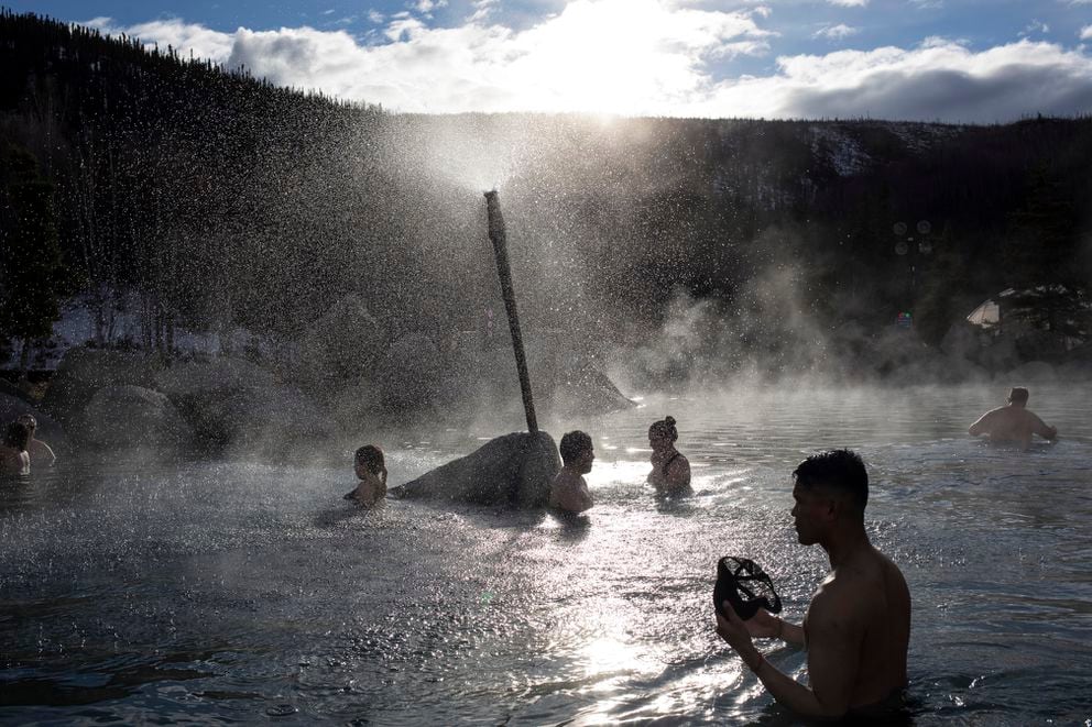 Tourists relax at the Chena Hot Springs Resort, northeast of Fairbanks, on Saturday, April 13, 2019. (AP Photo/Rodrigo Abd)