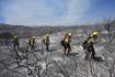 Wildfires in Southern California torch dozens of homes and force thousands to evacuate